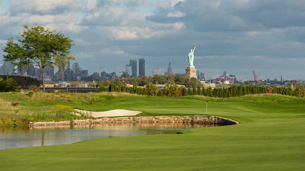View of Liberty National Golf Course with Statue of Liberty in the distance.