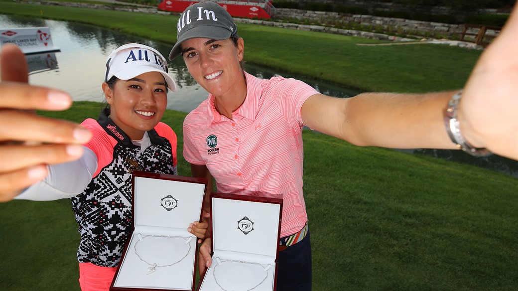 Jasmine Suwannapura and Cydney Clanton celebrate after winning the inaugural DOW Great Lakes Bay Invitational